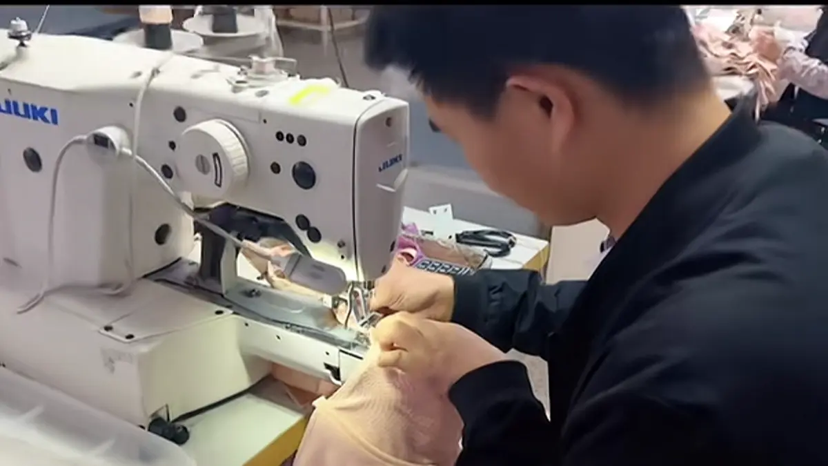 Bra sewing operation at an industrial sewing machine